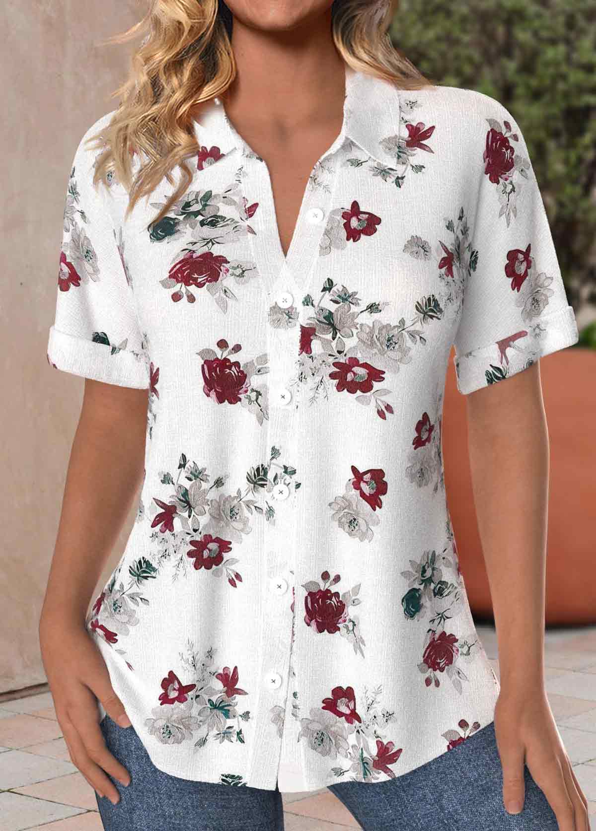 White blouse with floral print, front buttons, short sleeves and shirt-style collar.