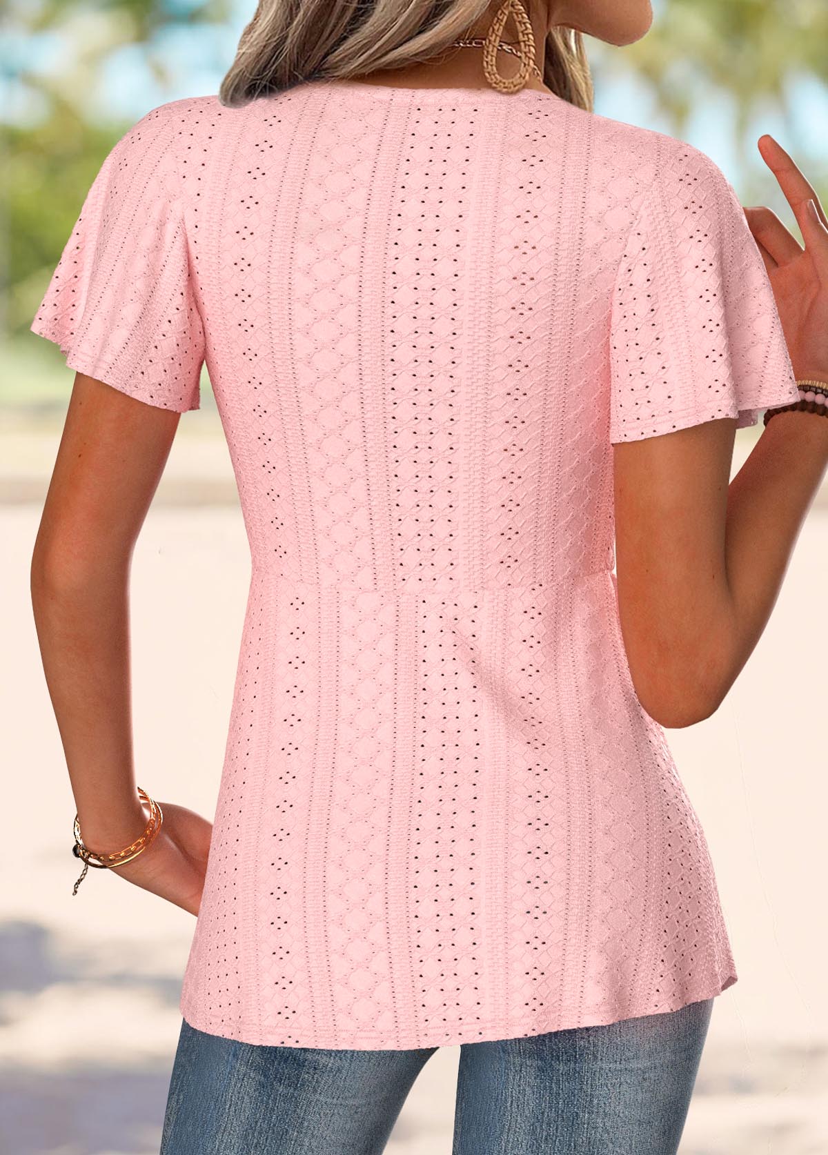 Light pink t-shirt with short sleeves and V-neckline
